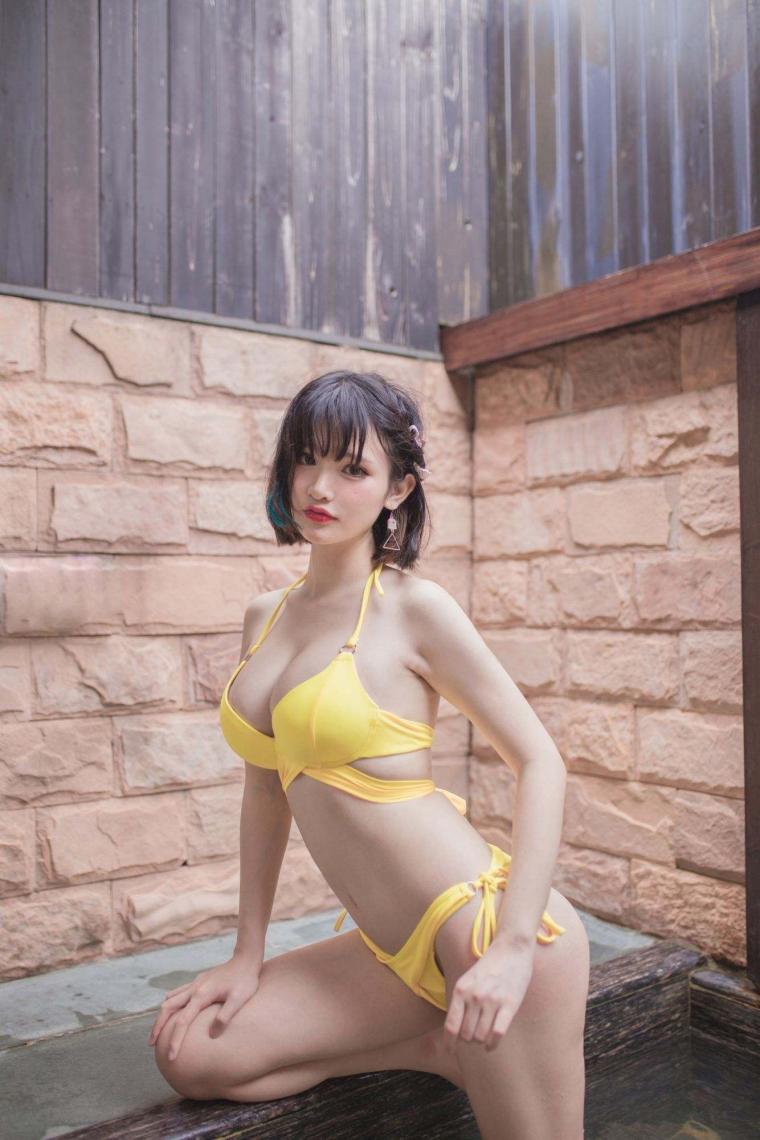 a woman in a yellow bikini