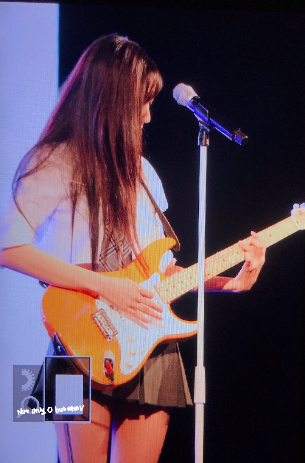 LOVELYZ's Ryu Su-Jeong sings while playing the electric guitar at the university event