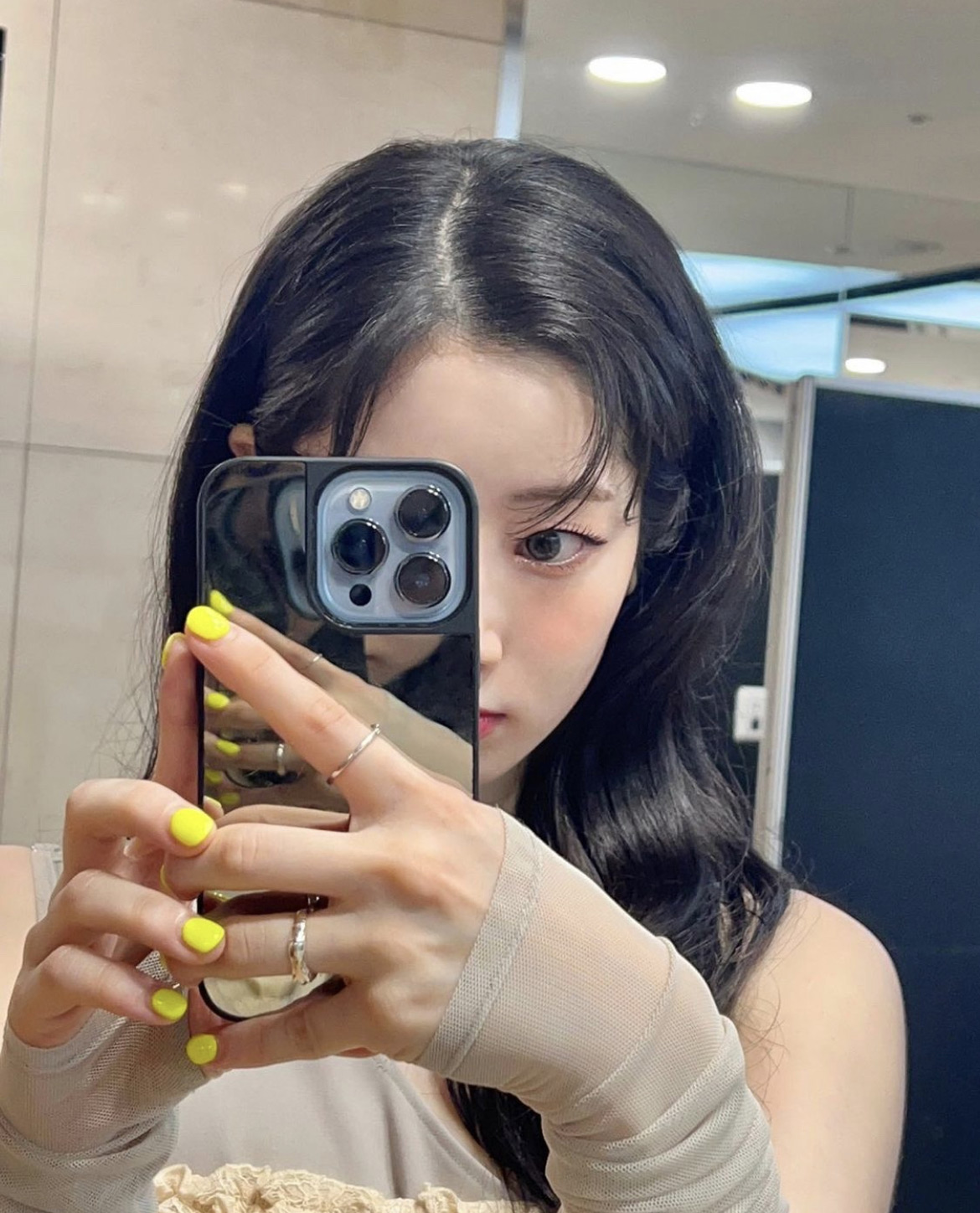 DAHYUN is taking a mirror selfie