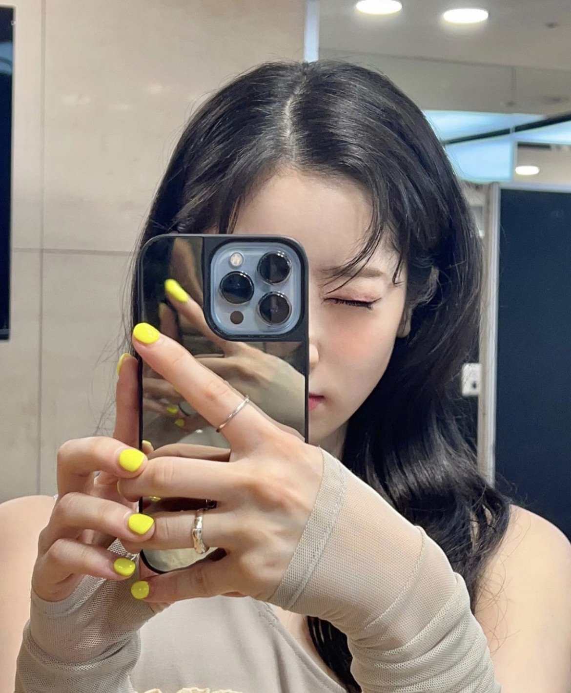 DAHYUN is taking a mirror selfie