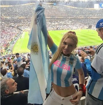 A picture of a woman wearing an Argentine shirt