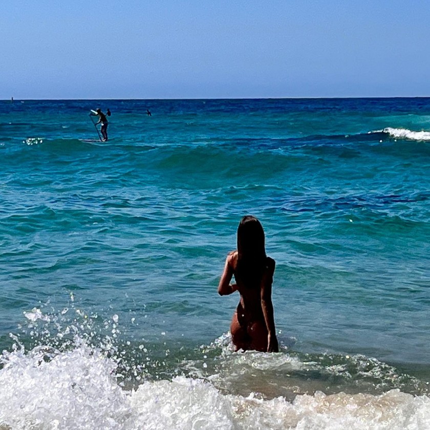 Girls' Generation Yuri with a guitar swimsuit on the back.