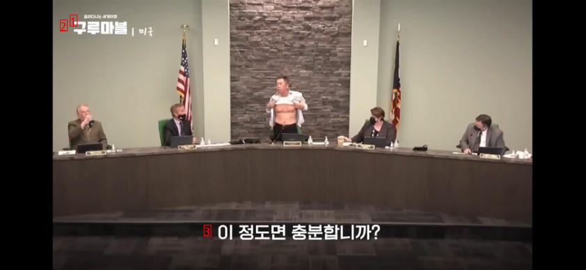 an Asian who suddenly takes off his clothes saying he is against racism