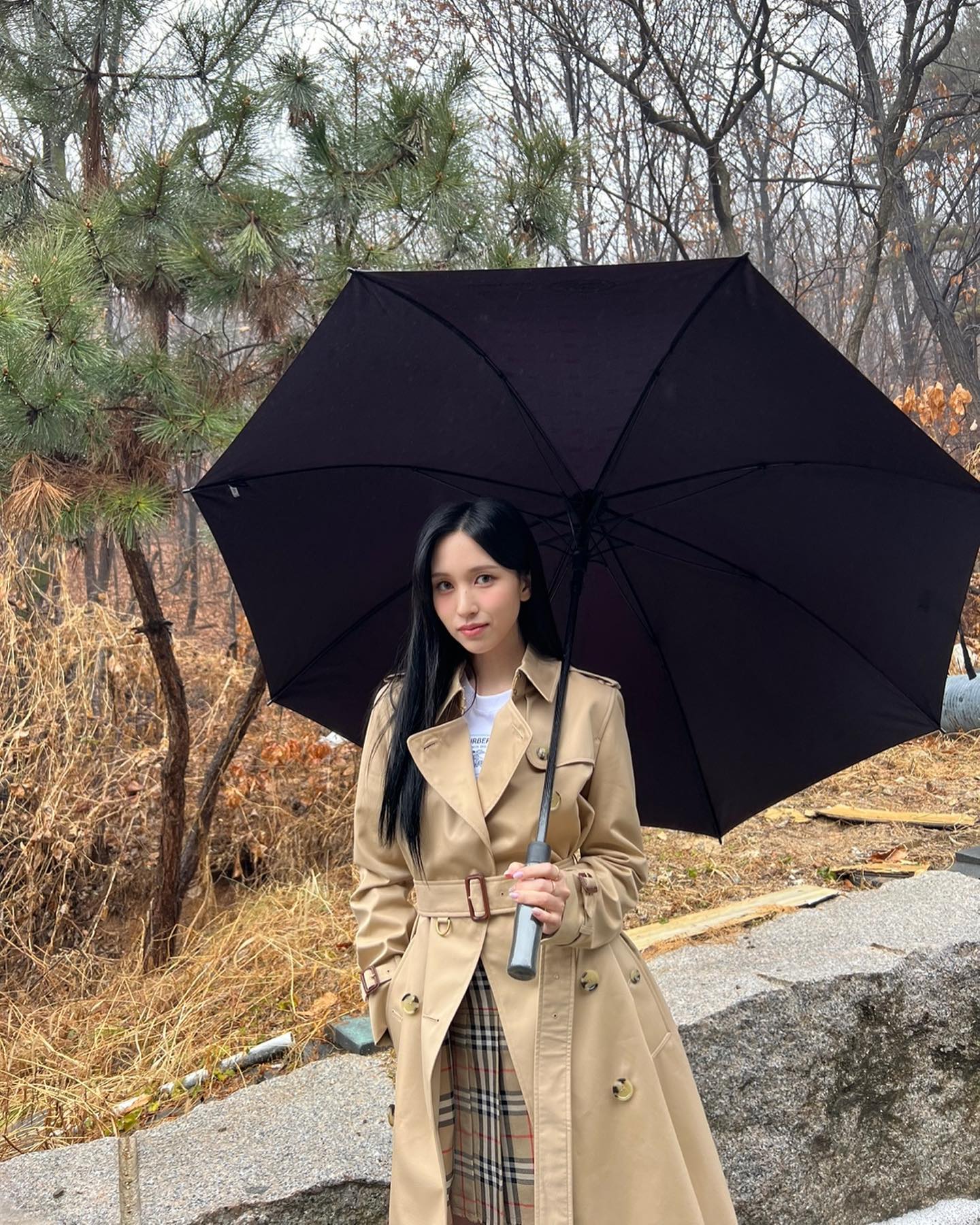 TWICE MINA in a Burberry coat.