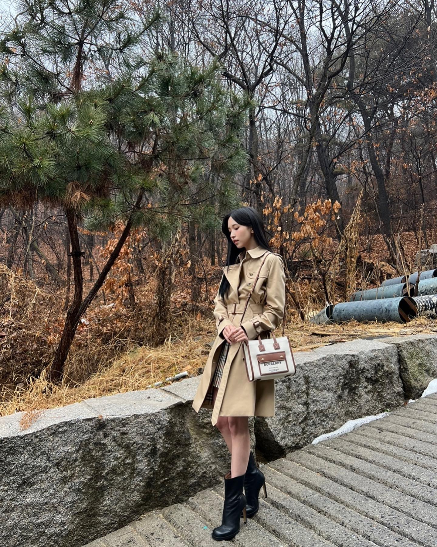 TWICE MINA in a Burberry coat.