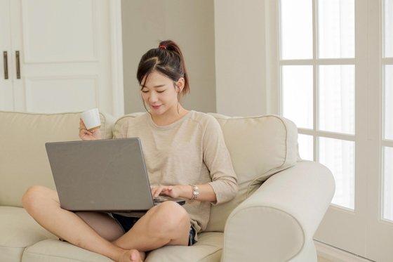 Koreans Sitting on the Floor with Sofa Left Behind