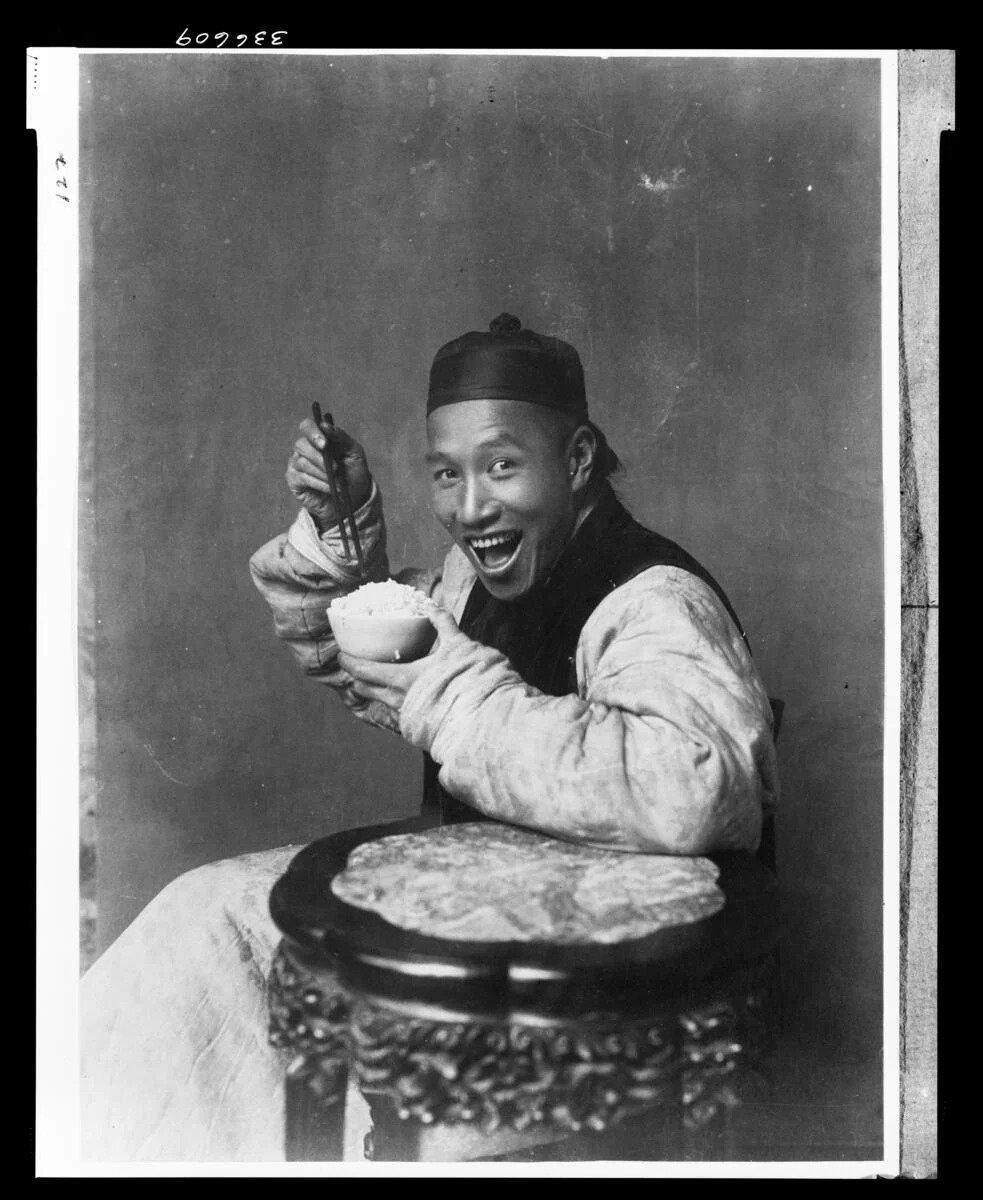 A picture of a man eating around 1901