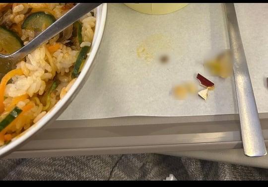 Who broke three teeth while eating Asiana's in-flight meal