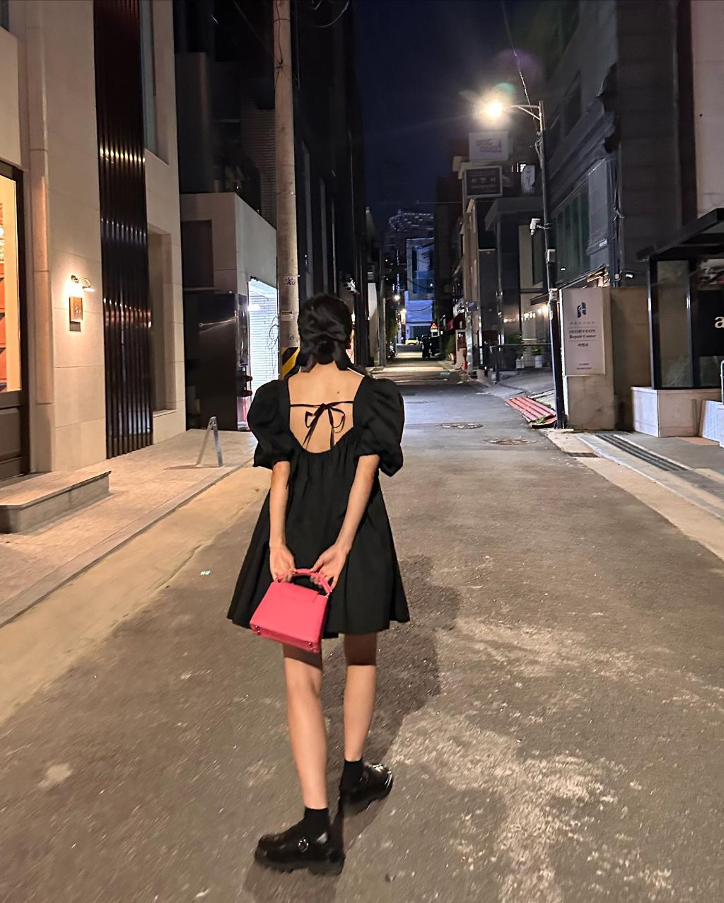 Red Velvet's Seulgi in a black dress on the street