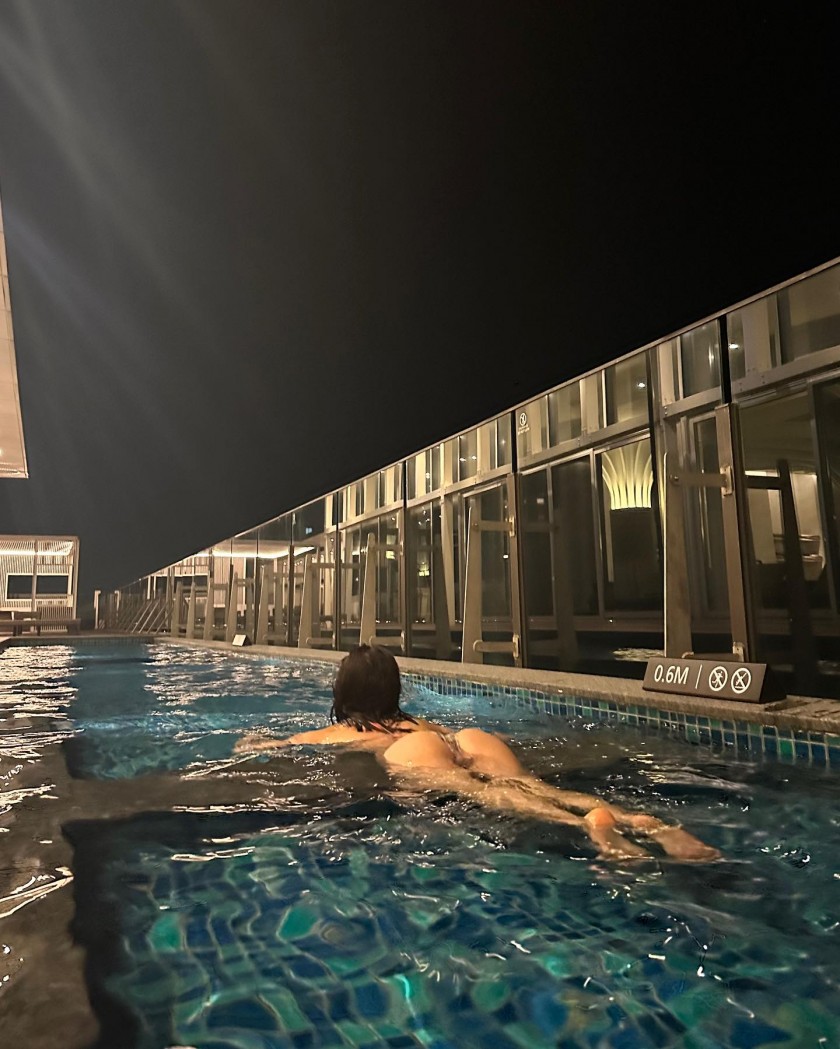 Myeong Ah-Choo showing off her high-leg swimsuit in the pool