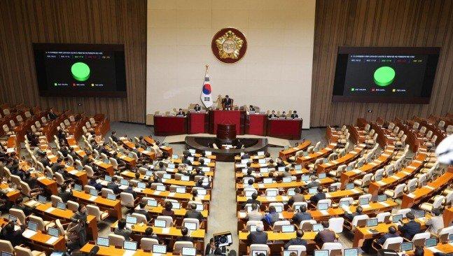 Photos of bereaved families passing the Itaewon Disaster Special Act