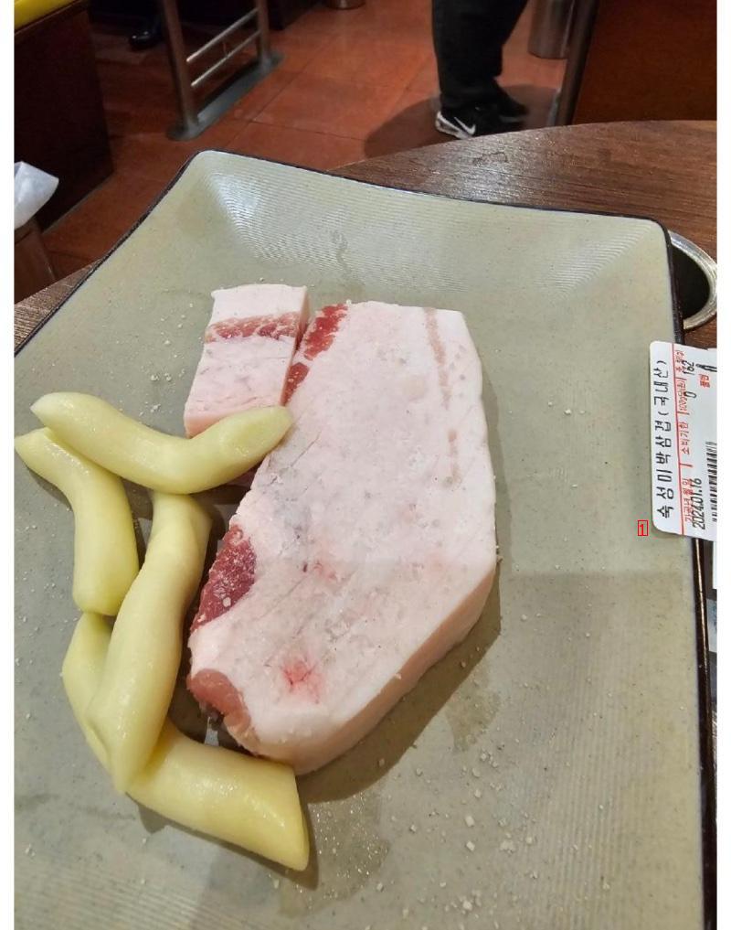 A gourmet pork belly at a restaurant.