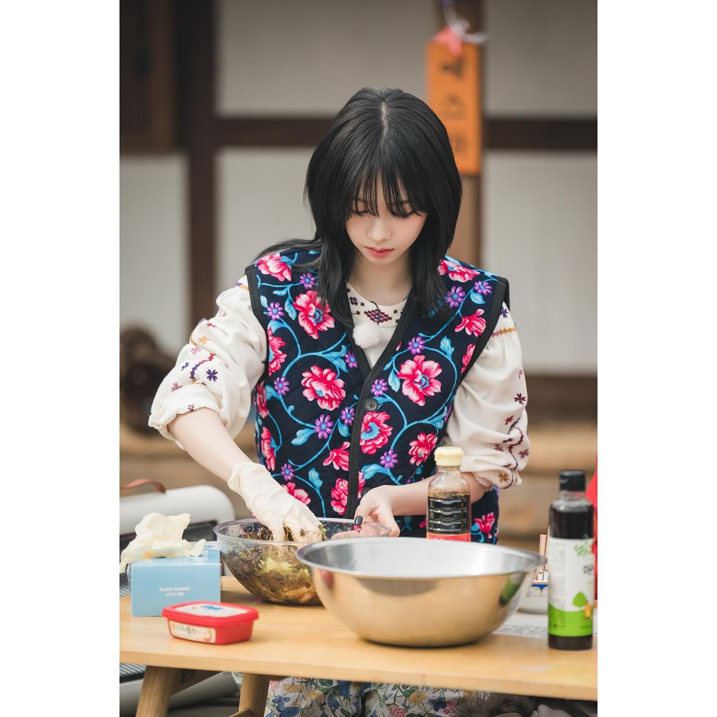 Looking at Karina's posture, it looks like she's doing some cooking.