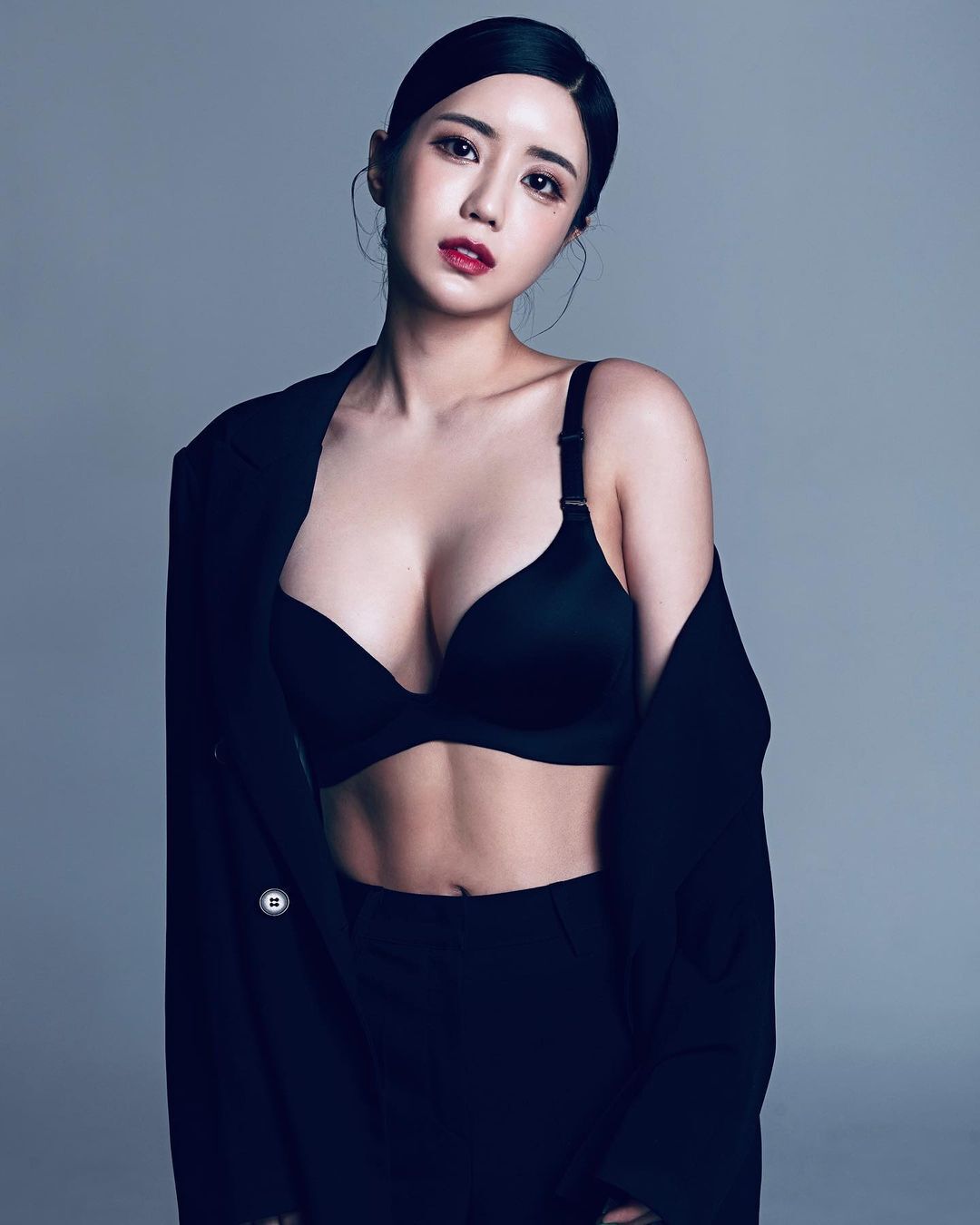 African BJ Seoyoon photo shoot black lace bra cleavage in formal suit
