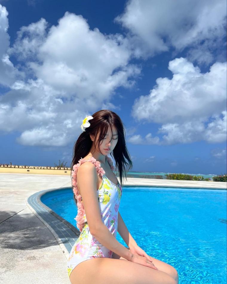 Slender body in white floral one-piece swimsuit at Dalsubin swimming pool