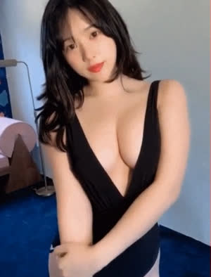 Chae-ah's bold swimsuit shows off her cleavage with her arms