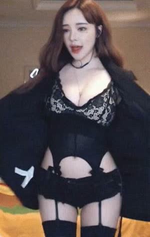 Sun Ming black lingerie under a black coat