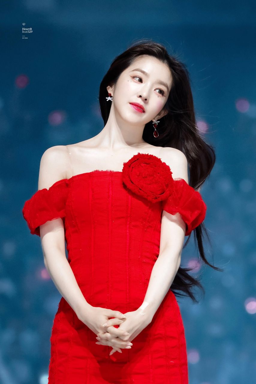 Red Velvet Irene going up the stairs red off-shoulder mini dress hips