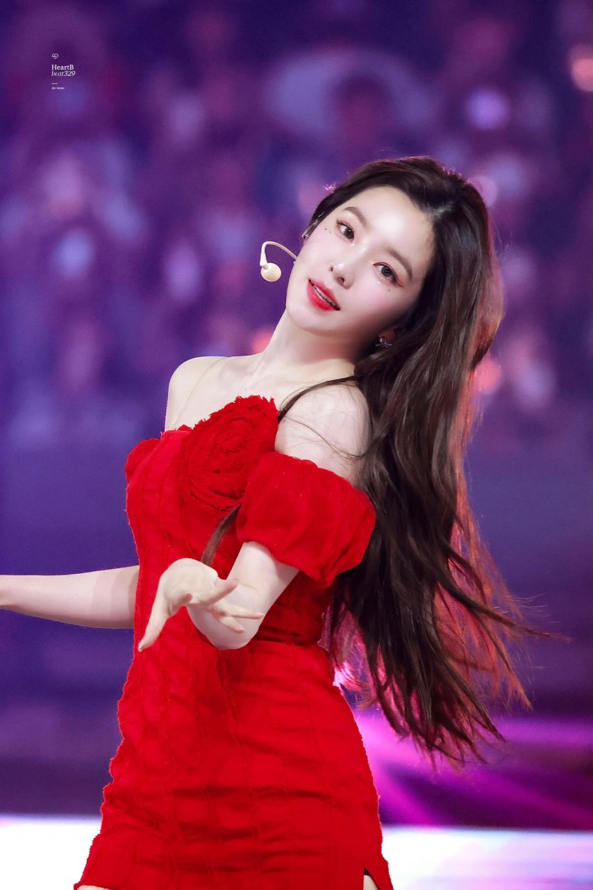 Red Velvet Irene going up the stairs red off-shoulder mini dress hips