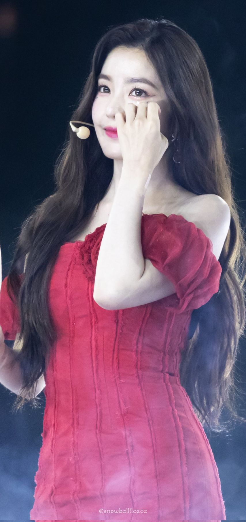 Red Velvet Irene going up the stairs red off-shoulder mini dress hips