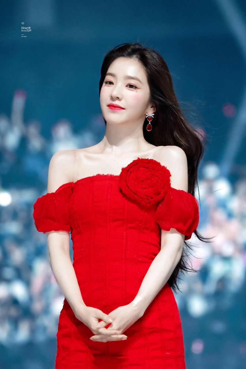 Red Velvet Irene going up the stairs red off-shoulder mini dress hips