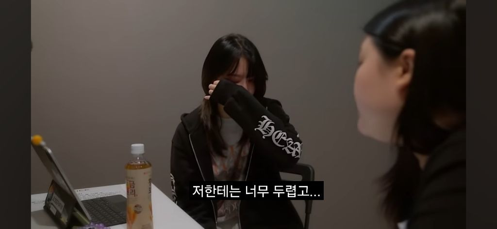 Sakura crying in the recently released Le Seraphim documentary