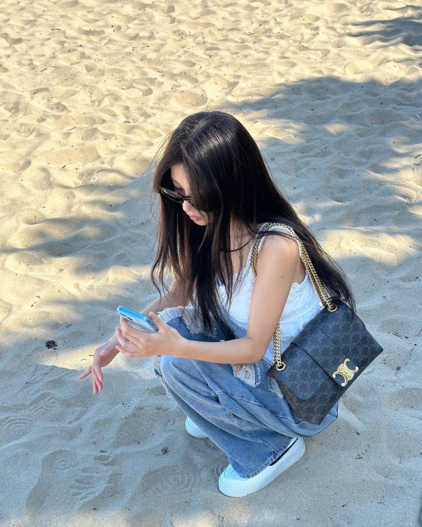 Kang Hye-won's subtle cleavage taken from above in a lace white string tank top