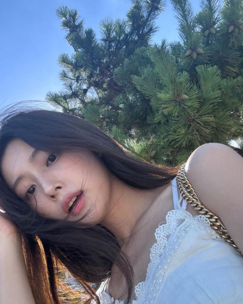 Kang Hye-won's subtle cleavage taken from above in a lace white string tank top