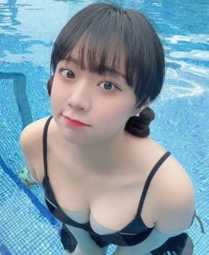 BJ tomato cleavage in black bikini submerged in swimming pool water