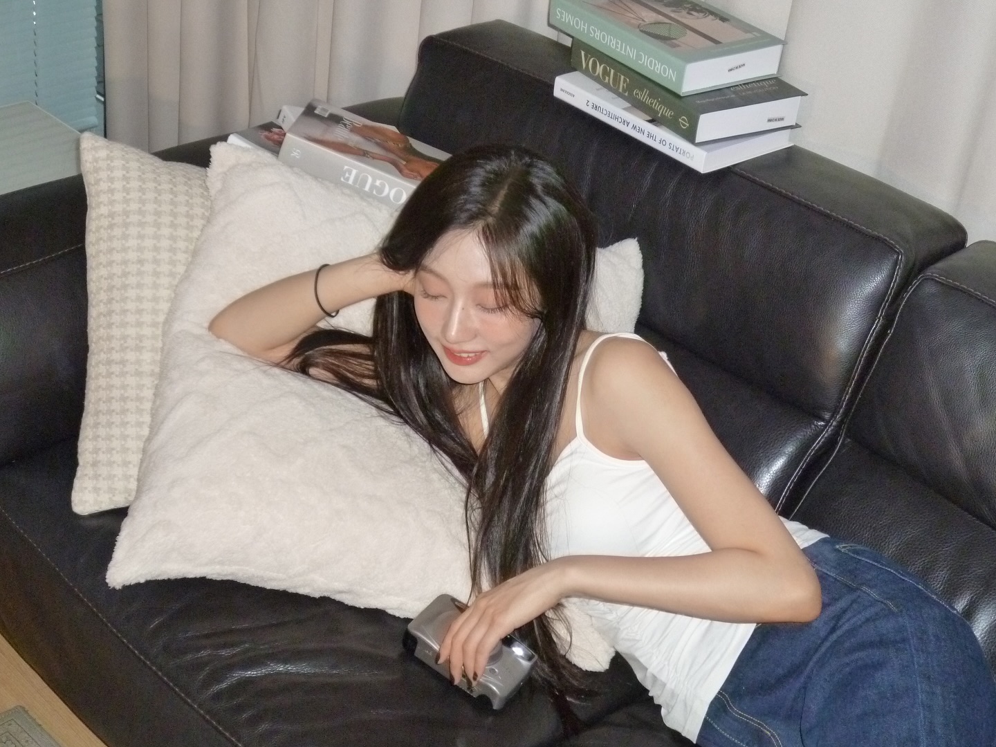 Lovelyz's Jeong Yein's body lying on the sofa wearing a puffy white thong tank top - Instagram