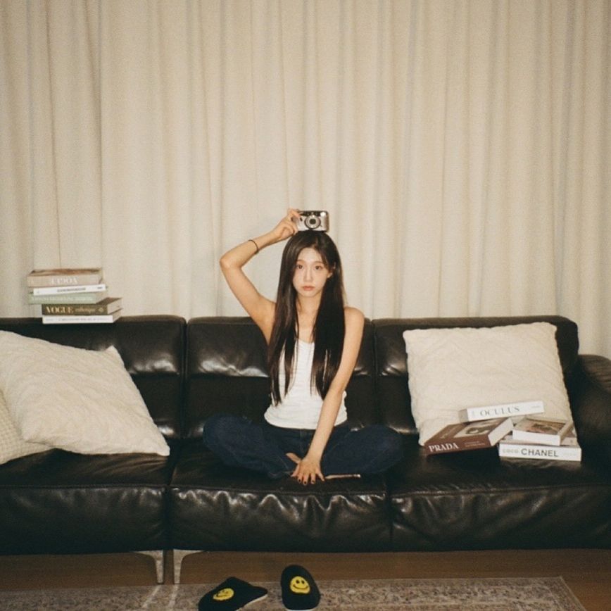 Lovelyz's Jeong Yein's body lying on the sofa wearing a puffy white thong tank top - Instagram