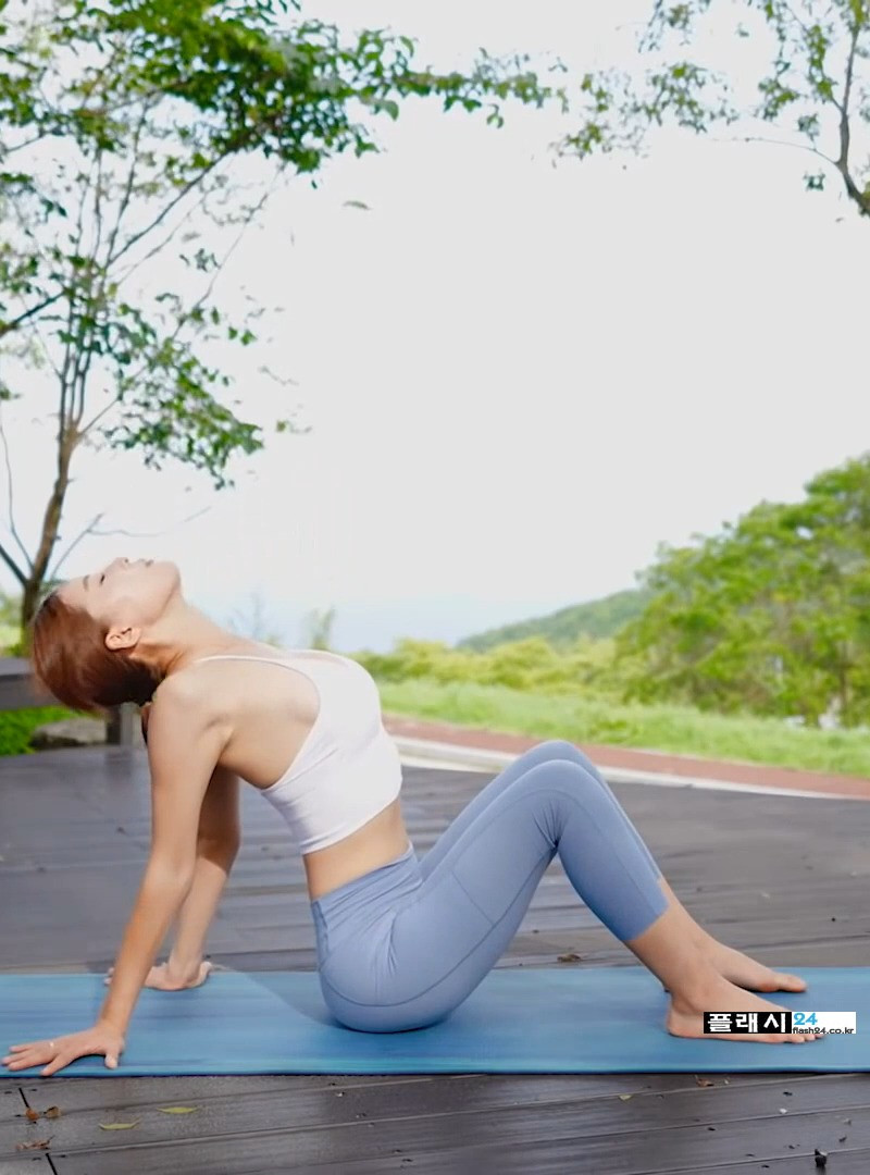 Yoga instructor Hwang Ayoung morning stretching in the mountains