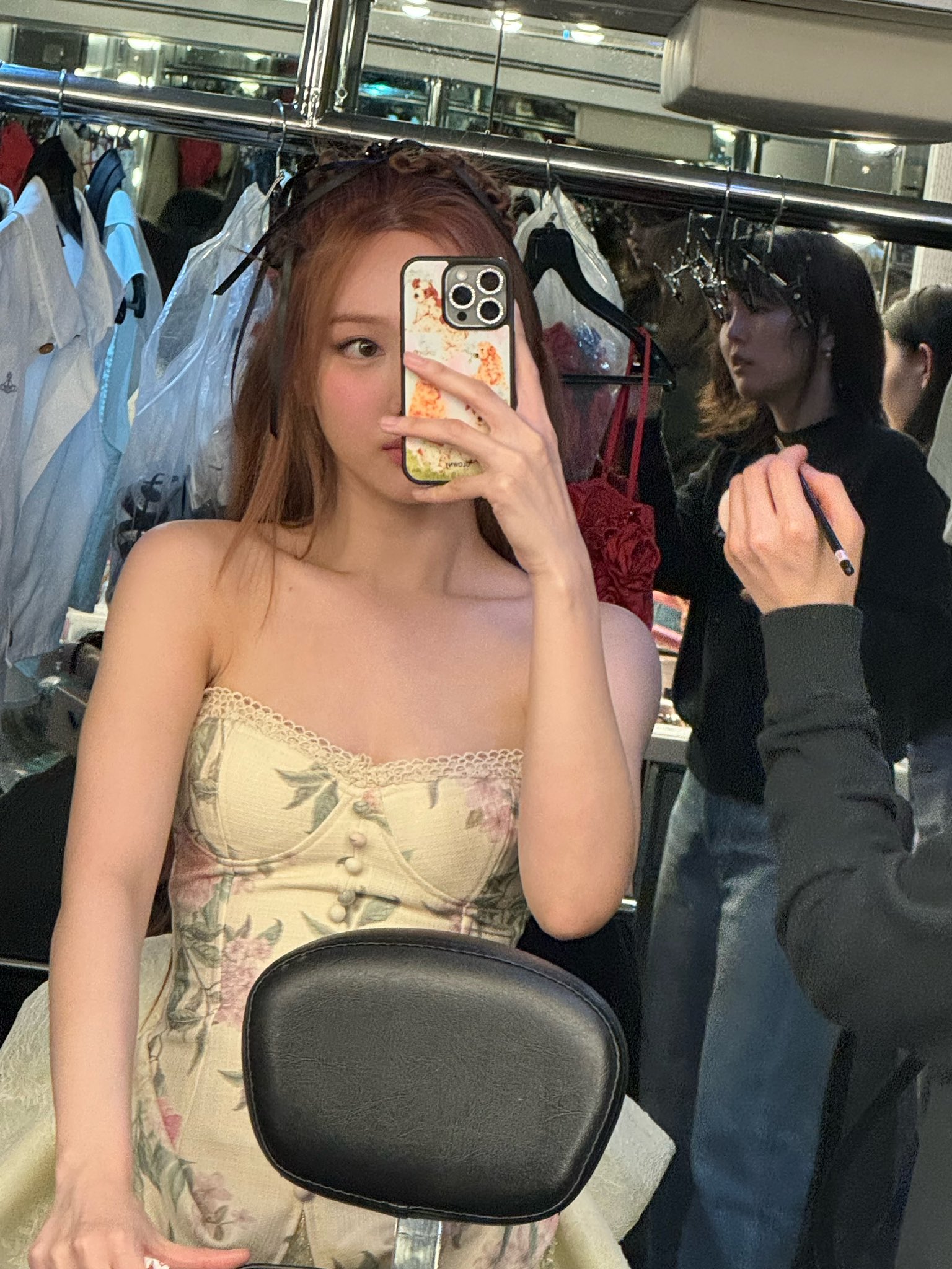 TWICE Nayeon's cleavage seen from above in red string tank top